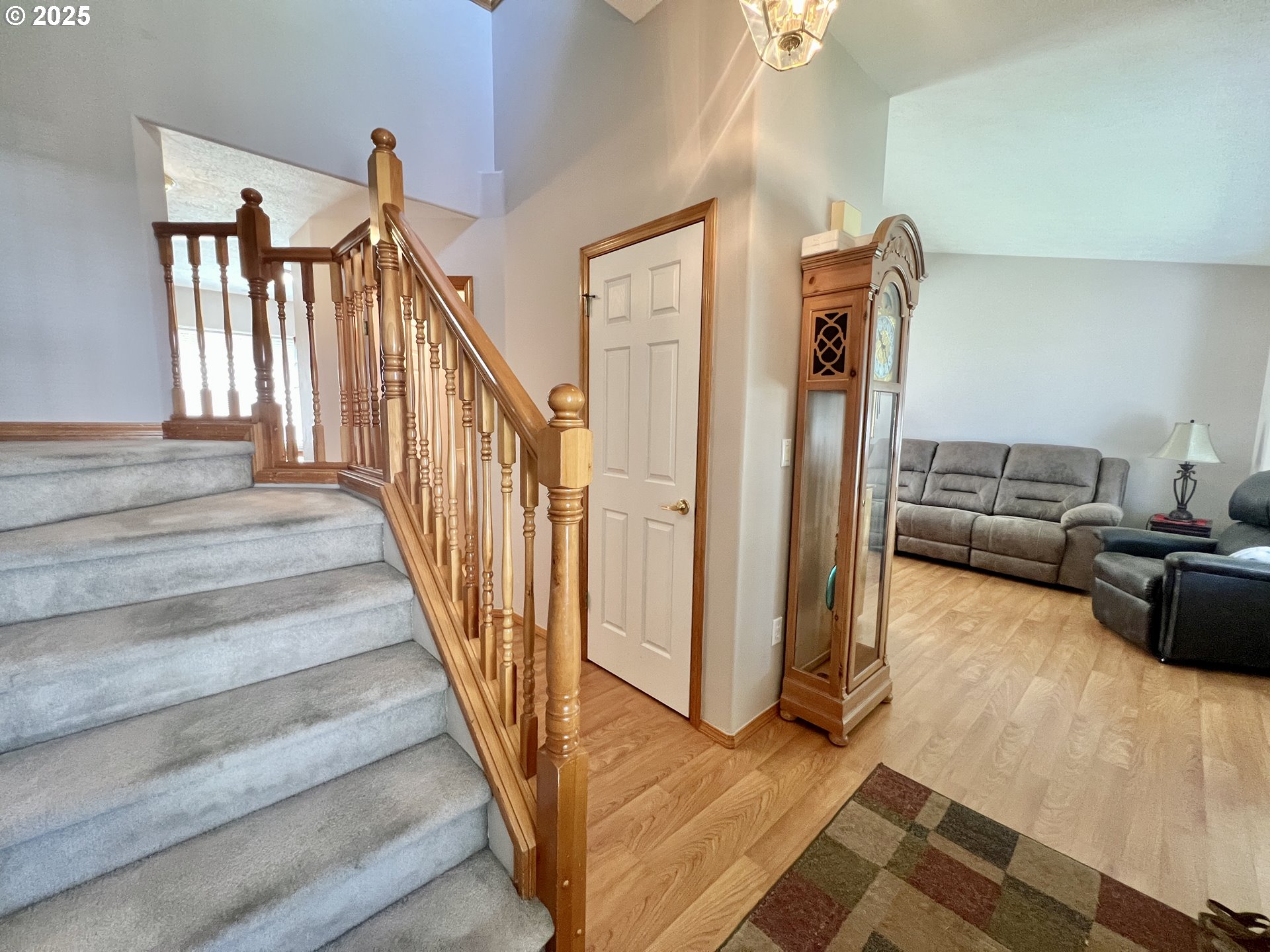 112 Northeast 11th Street Hermiston, OR 97838 - Photo 5 of 23 a view of a livingroom with wooden floor and stairs