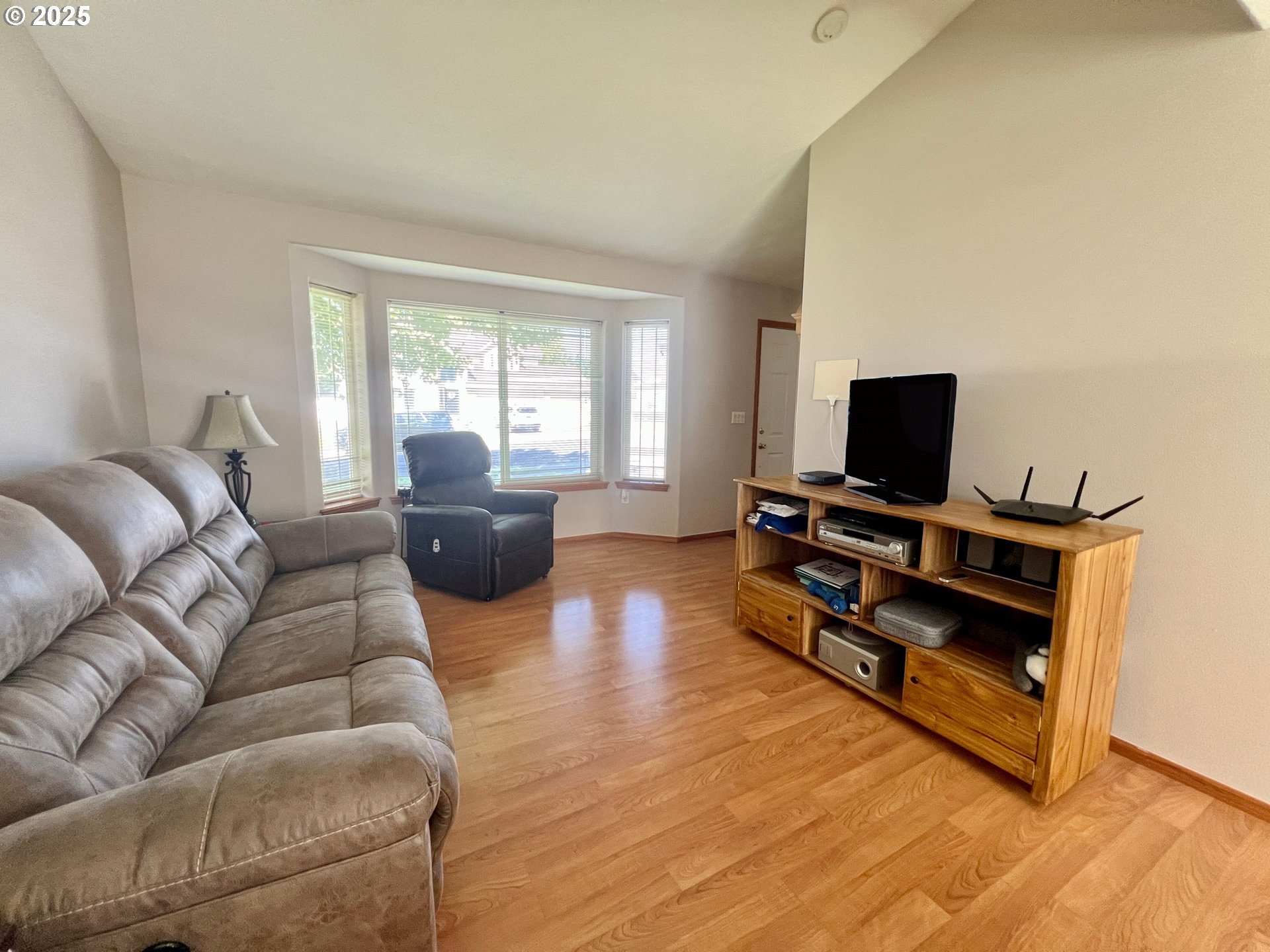 112 Northeast 11th Street Hermiston, OR 97838 - Photo 7 of 23 a living room with furniture and a flat screen tv