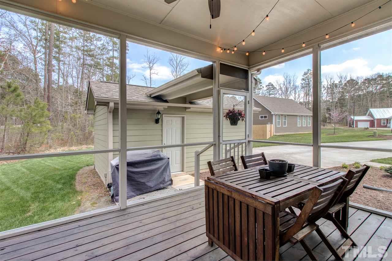 4 Moss Spring Court Durham, NC 27712 - Photo 23 of 25 Attached screened-in porch just off the kitchen