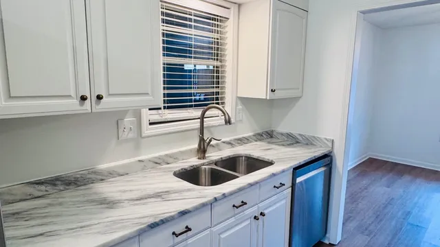 a kitchen with a sink and cabinets