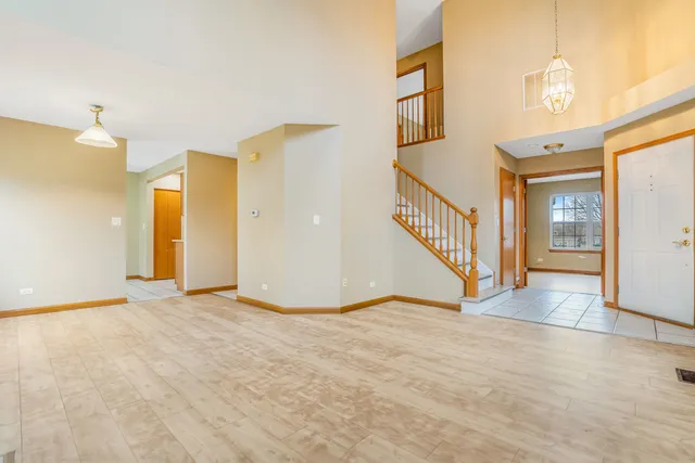 a view of an empty room with glass door