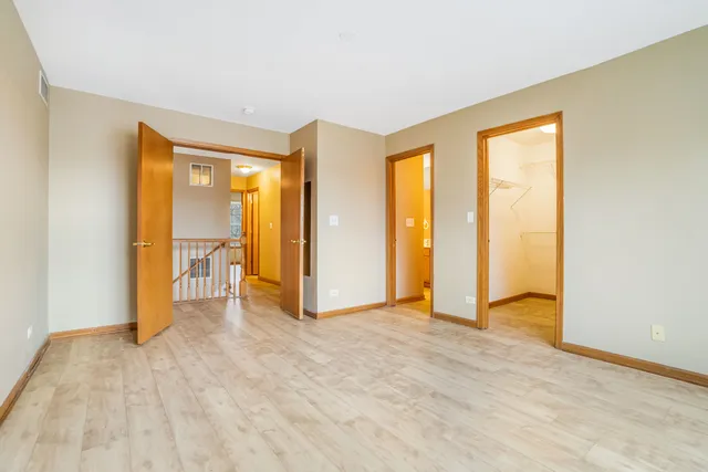 a view of an empty room with glass door