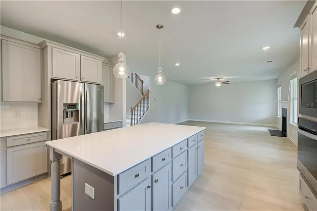 a kitchen with a refrigerator a sink and a refrigerator