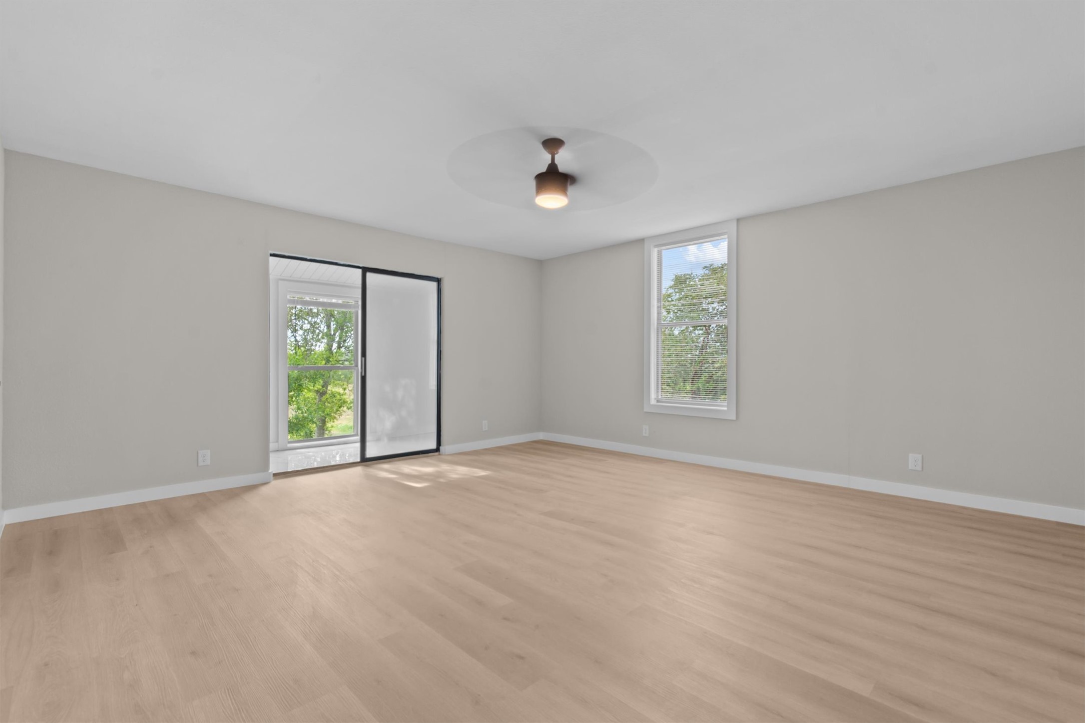 9100 Highway 183 Austin, TX 78747 - Photo 11 of 38 Warm wood flooring and clean lines define this versatile, light-filled living space.