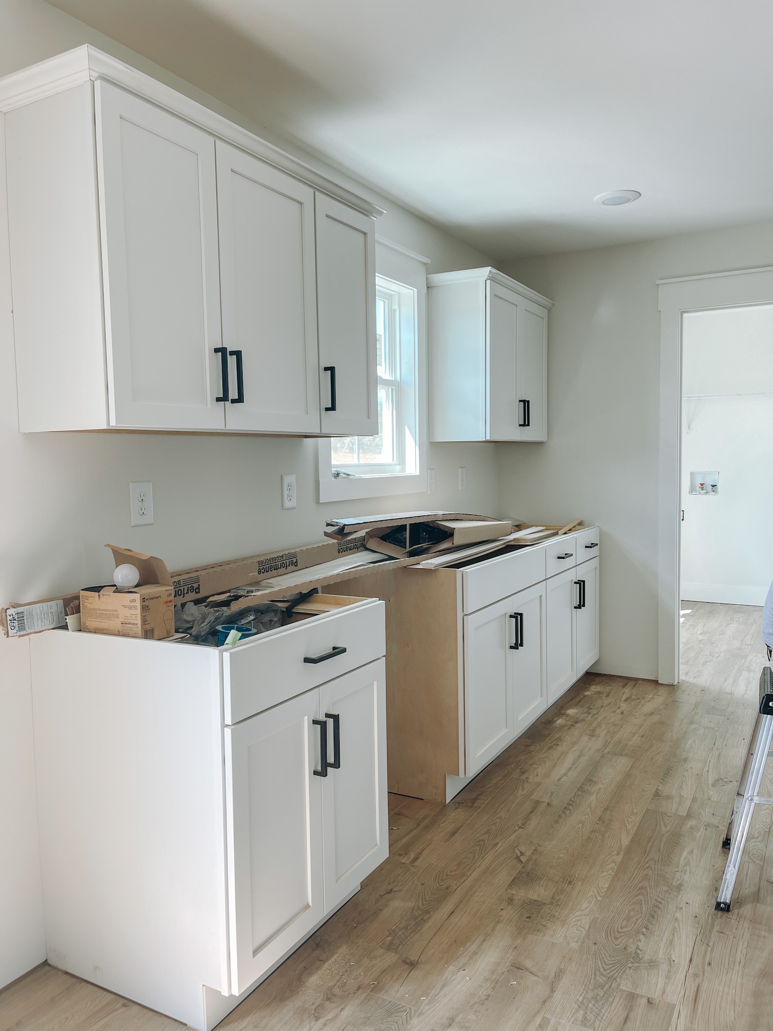 247 Tom Ferrell Road Portland, TN 37148 - Photo 5 of 10 a kitchen with granite countertop white cabinets and white appliances