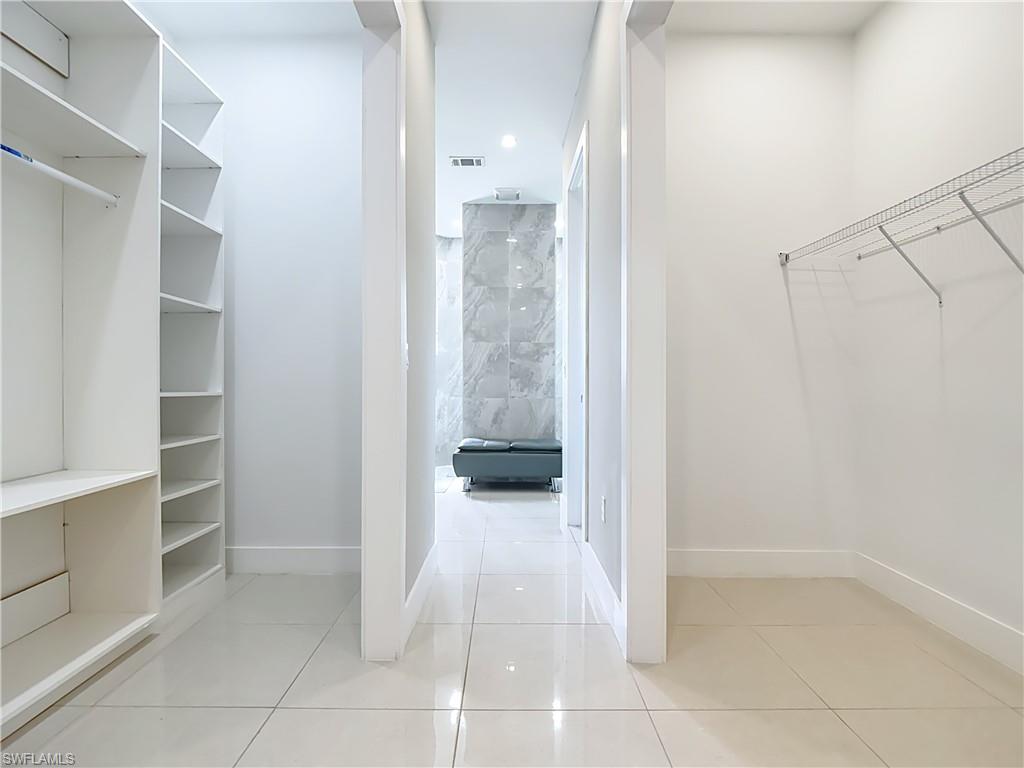 1806 41st Street Southwest Naples, FL 34116 - Photo 15 of 38 a view of a walk in closet and closet in a room