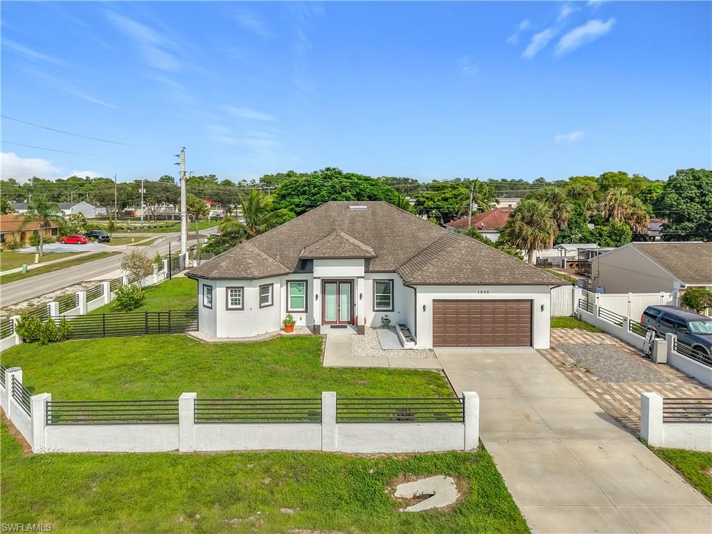 1806 41st Street Southwest Naples, FL 34116 - Photo 2 of 38 a view of a house with a big yard