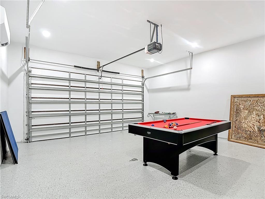 1806 41st Street Southwest Naples, FL 34116 - Photo 29 of 38 a room with pool table and windows