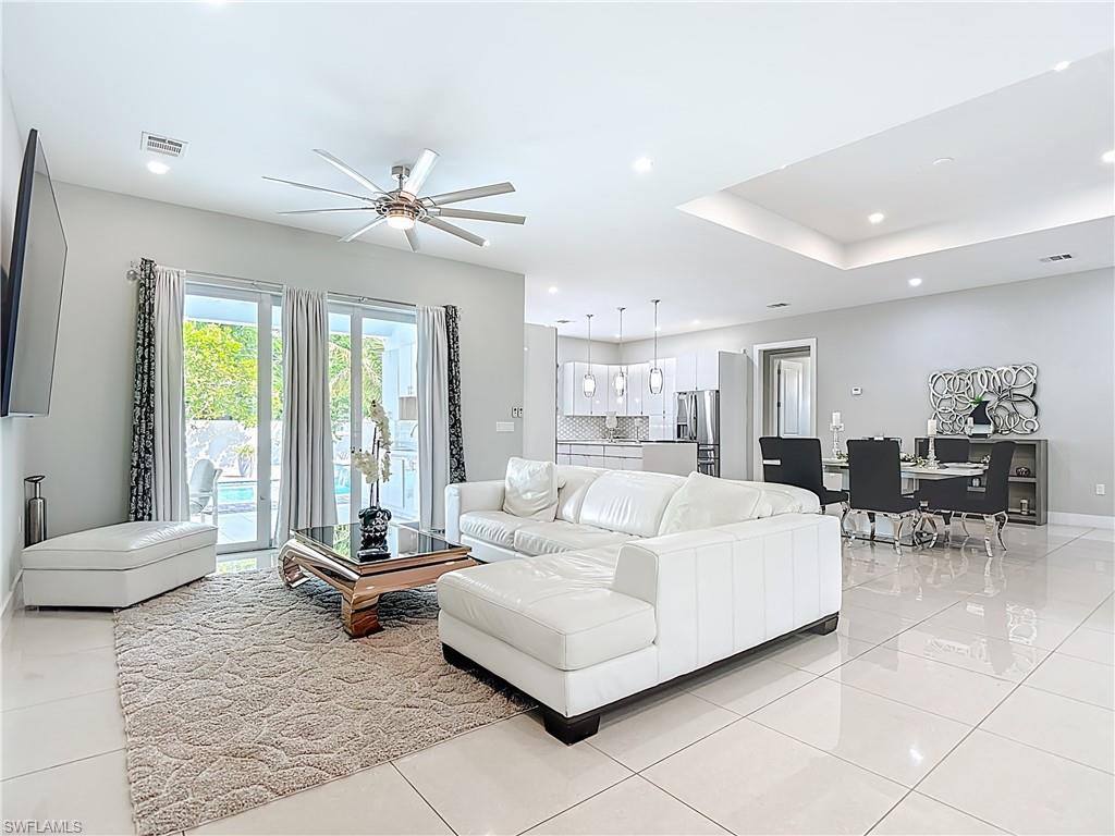 1806 41st Street Southwest Naples, FL 34116 - Photo 3 of 38 a living room with furniture and large windows