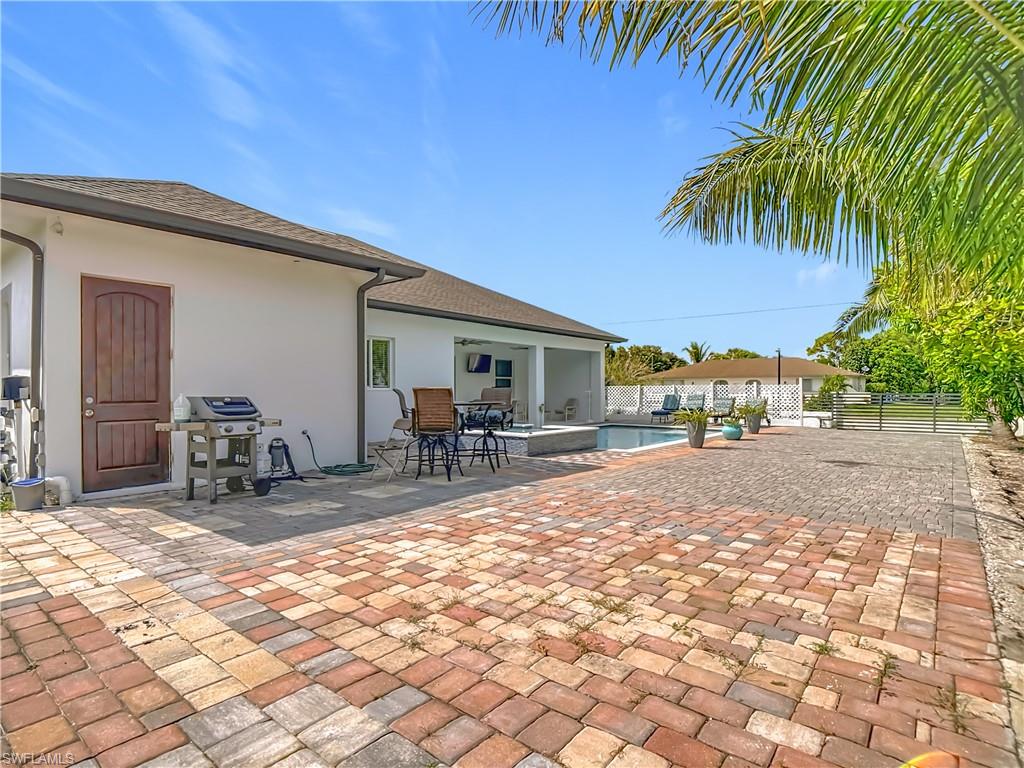 1806 41st Street Southwest Naples, FL 34116 - Photo 33 of 38 a view of a backyard with a patio