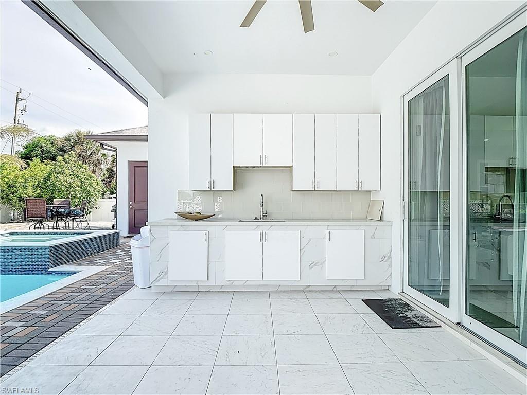 1806 41st Street Southwest Naples, FL 34116 - Photo 36 of 38 a kitchen with a cabinets and window