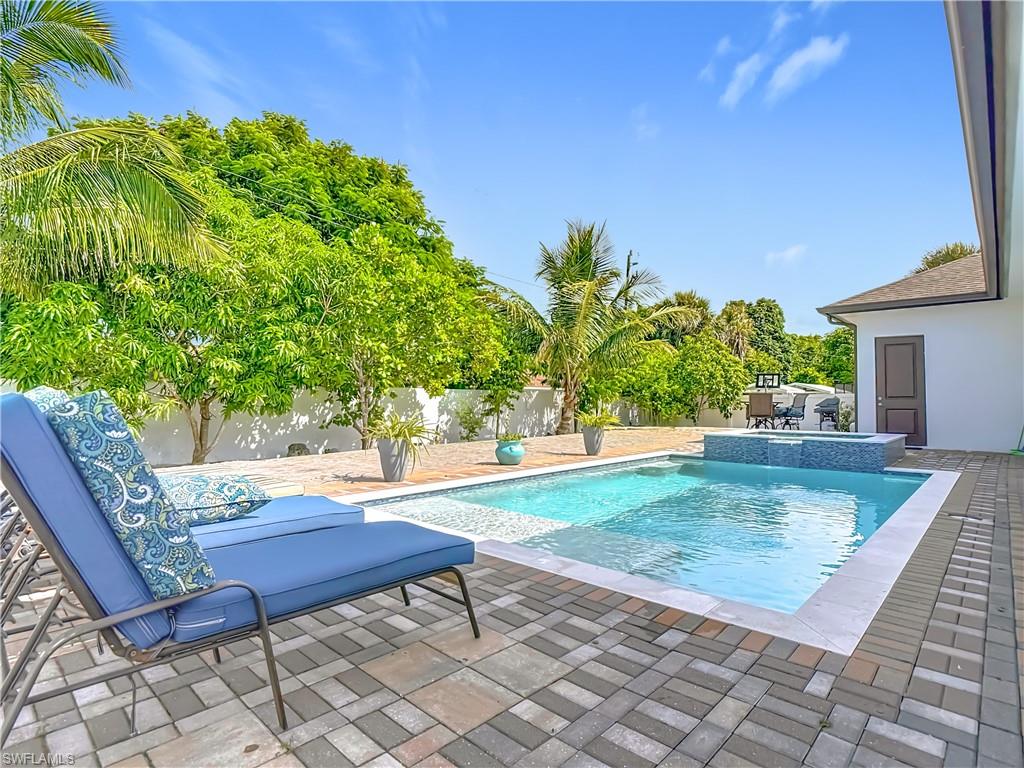 1806 41st Street Southwest Naples, FL 34116 - Photo 37 of 38 a view of a backyard with sitting area