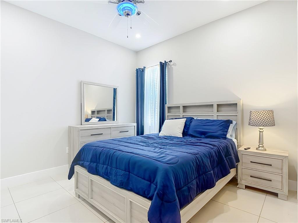 1806 41st Street Southwest Naples, FL 34116 - Photo 7 of 38 a bedroom with a bed and a closet