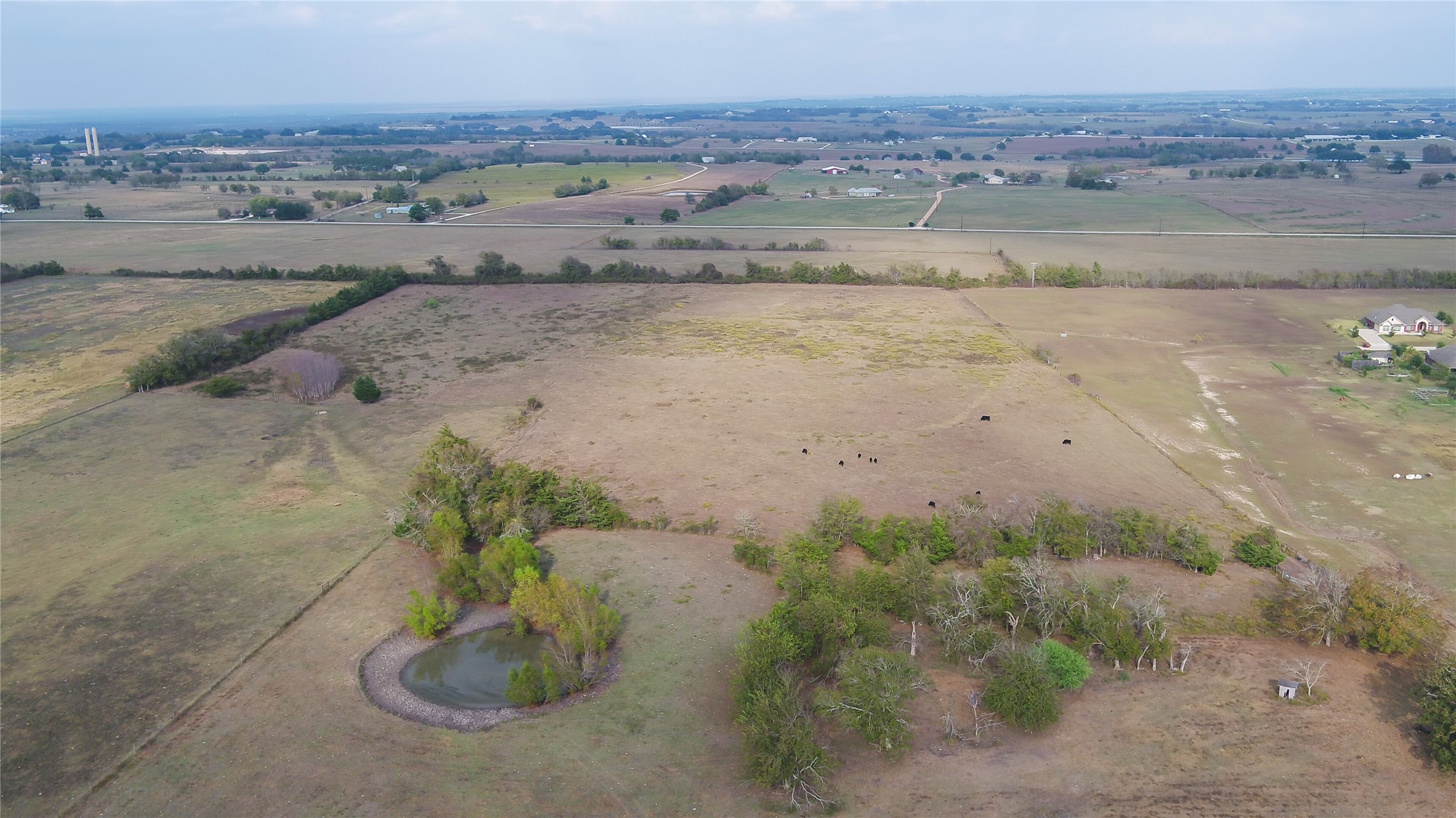 an aerial view of beach and yard