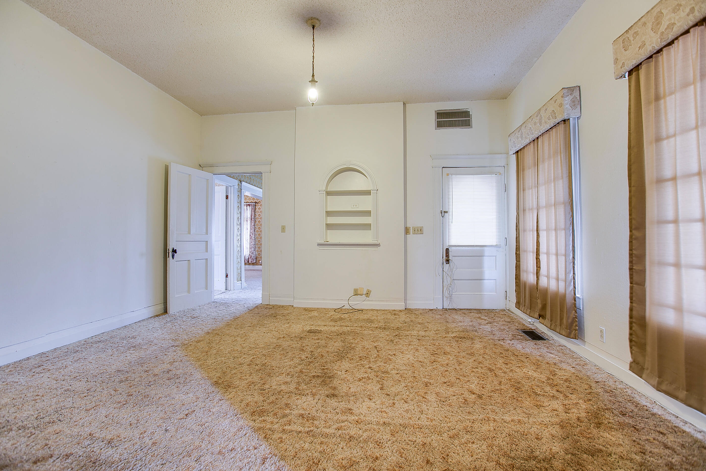 601 North 10th Street Ballinger, TX 76821 - Photo 14 of 29 Bedroom with built-in shelving