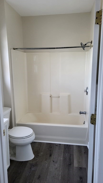 124 Stevens Street, Unit 3 Lowell, MA 01851 - Photo 10 of 18 a bathroom with a toilet and a shower