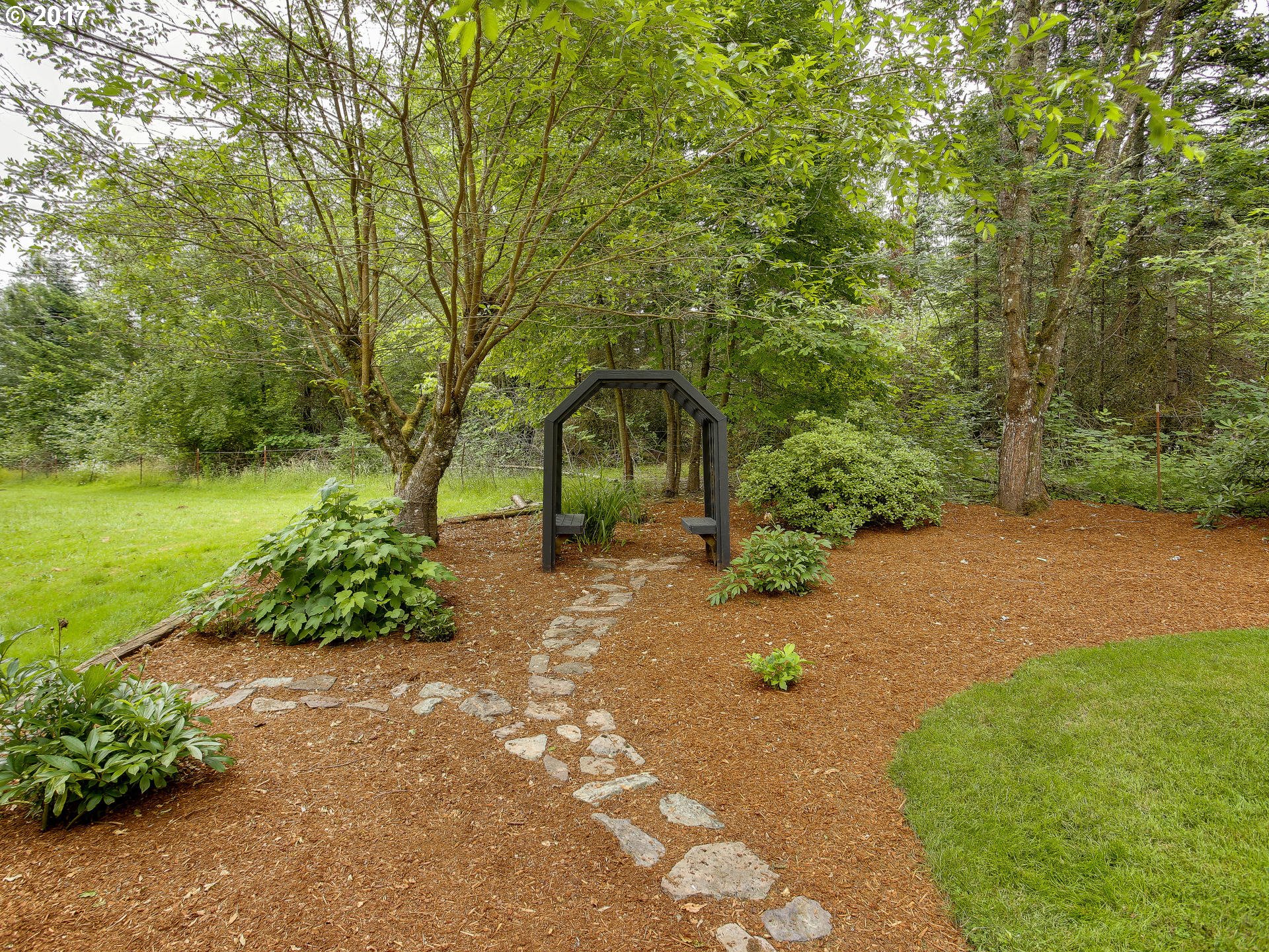 22374 Southeast Ridgeview Drive Damascus, OR 97089 - Photo 11 of 32 a backyard of a house with a yard and outdoor seating