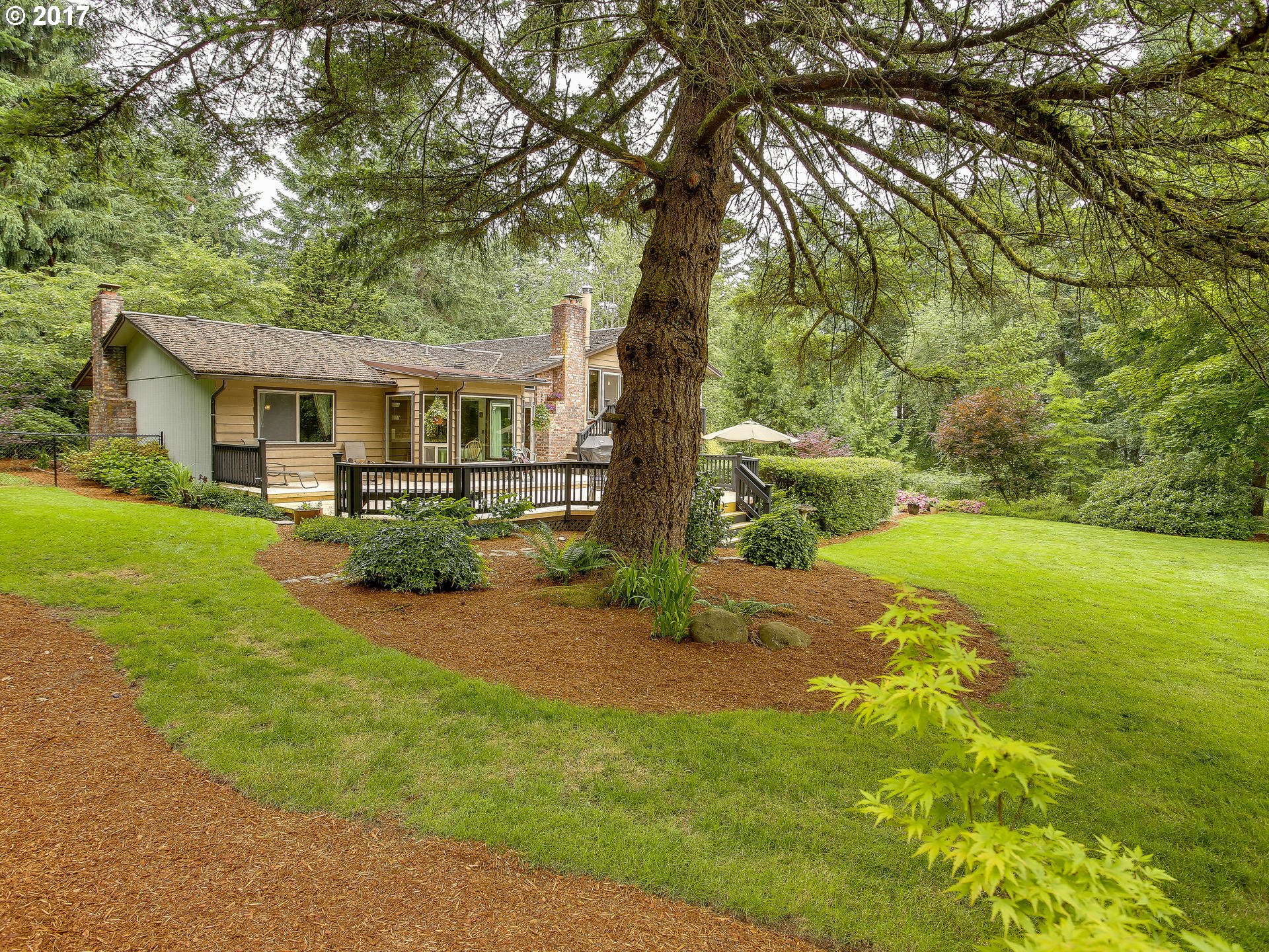 22374 Southeast Ridgeview Drive Damascus, OR 97089 - Photo 14 of 32 a front view of house with yard and green space