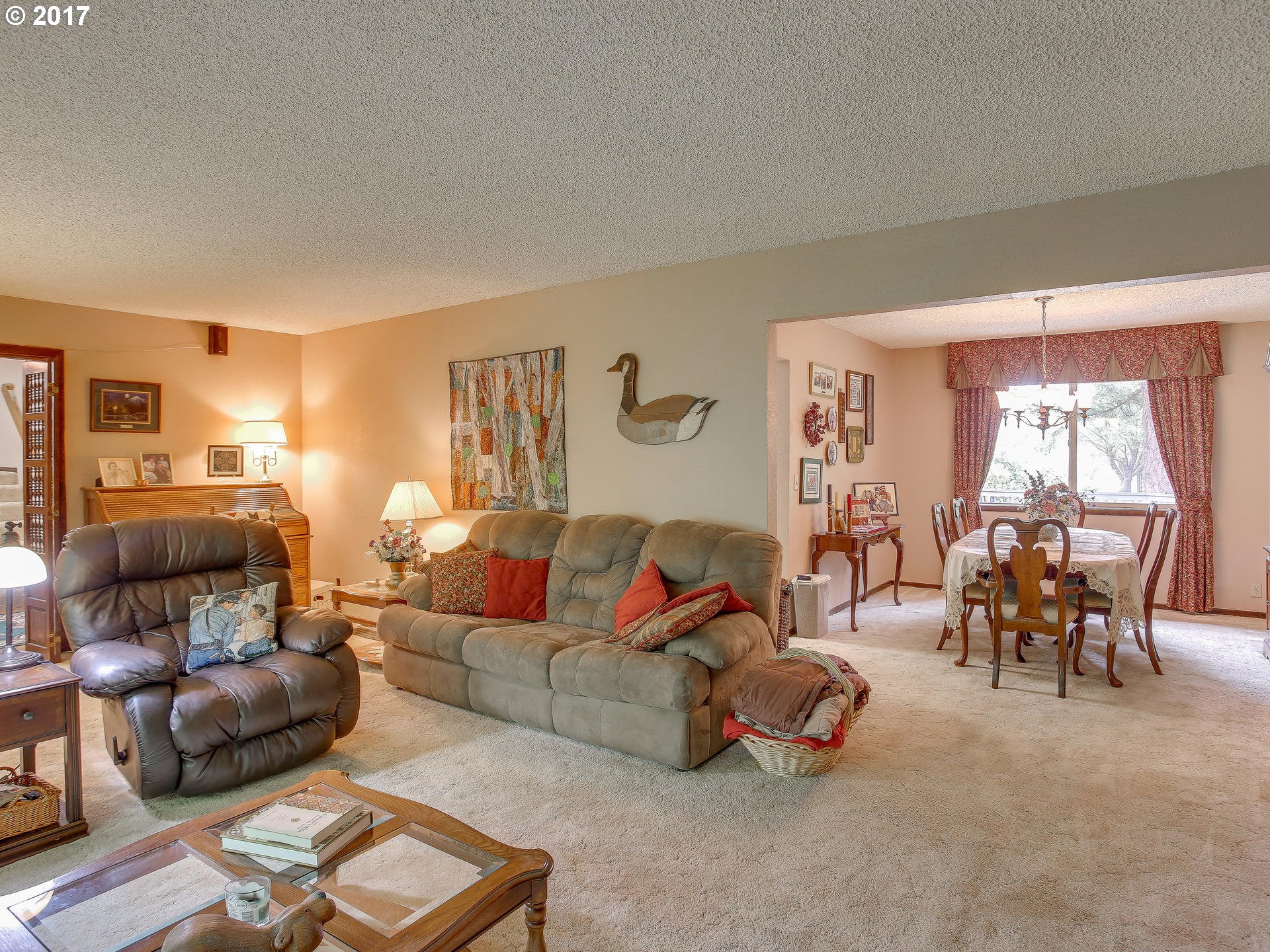 22374 Southeast Ridgeview Drive Damascus, OR 97089 - Photo 15 of 32 a living room with furniture and a large window