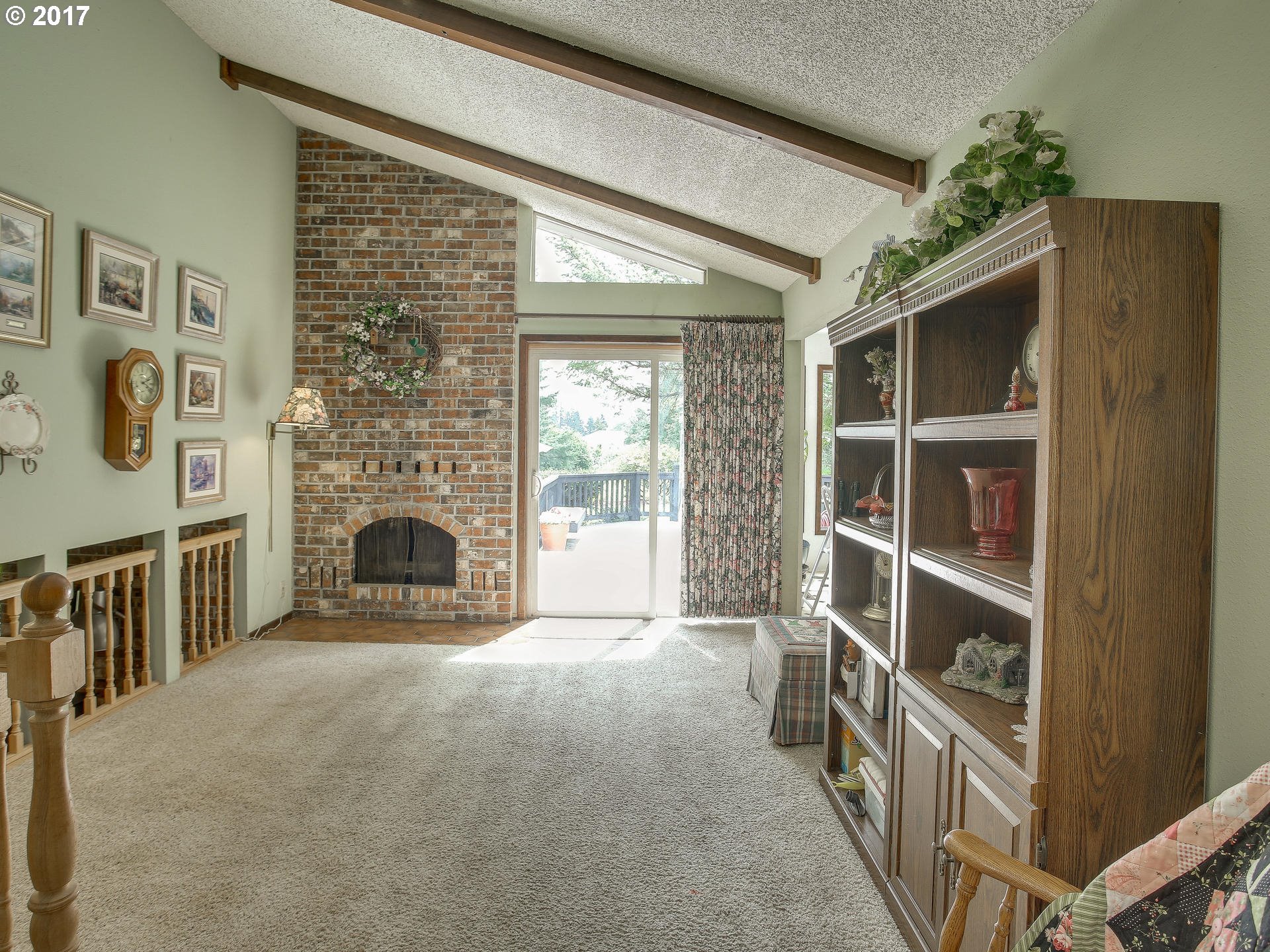 22374 Southeast Ridgeview Drive Damascus, OR 97089 - Photo 17 of 32 a view of an empty room with a fireplace and a window