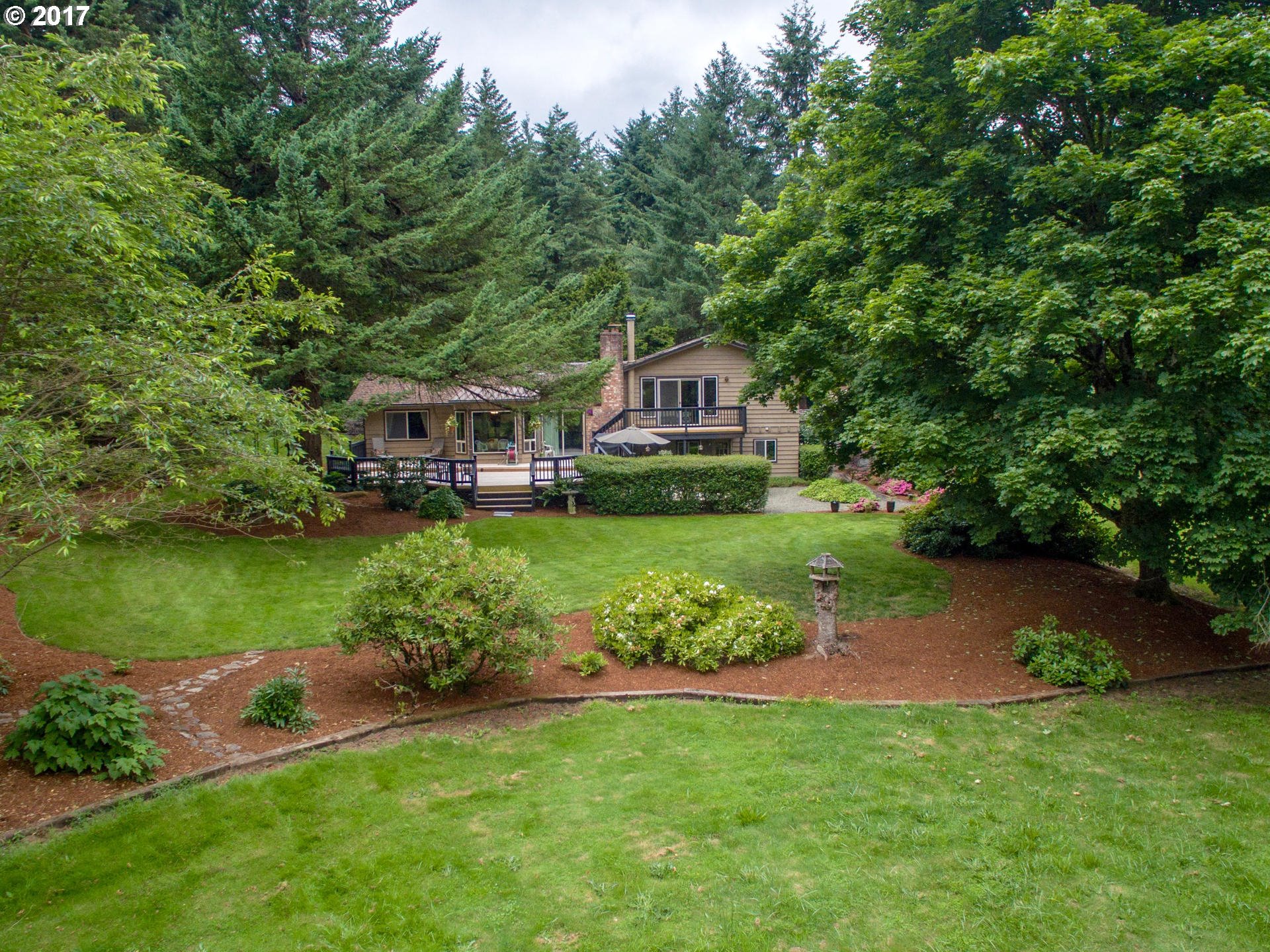 22374 Southeast Ridgeview Drive Damascus, OR 97089 - Photo 3 of 32 a front view of a house with garden