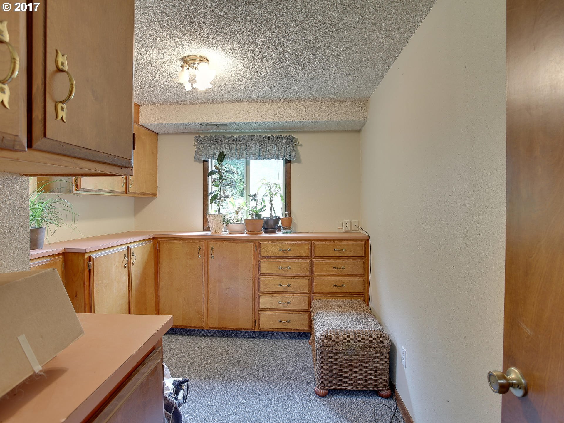 22374 Southeast Ridgeview Drive Damascus, OR 97089 - Photo 31 of 32 a hallway with couches and a potted plant