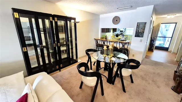 a bathroom with a granite countertop sink a mirror and shower