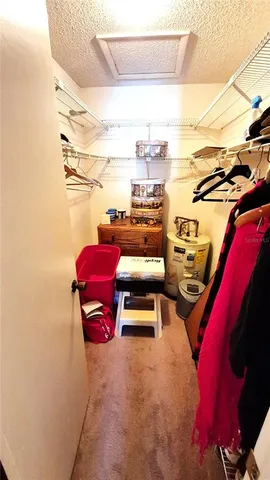 a view of bathroom with a sink and mirror