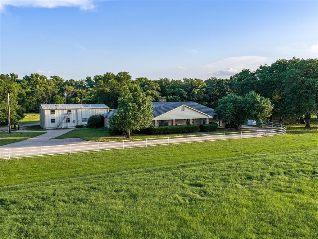 449 Private Road 4670 Rhome, TX 76078 - Photo 12 of 39 a aerial view of a house with swimming pool garden and patio