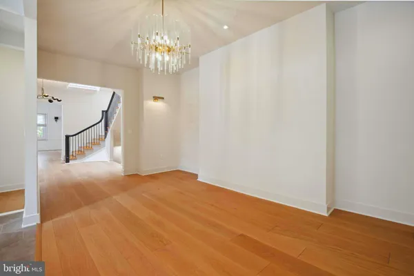 a view of an empty room with a window and fireplace