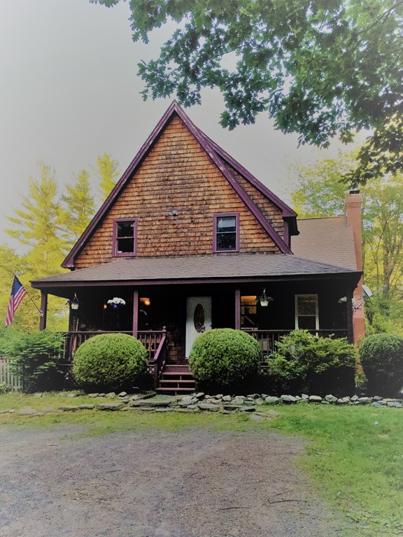 47 Laurel Lake Road Royalston, MA 01368 - Photo 1 of 10 a front view of a house with a yard and garage