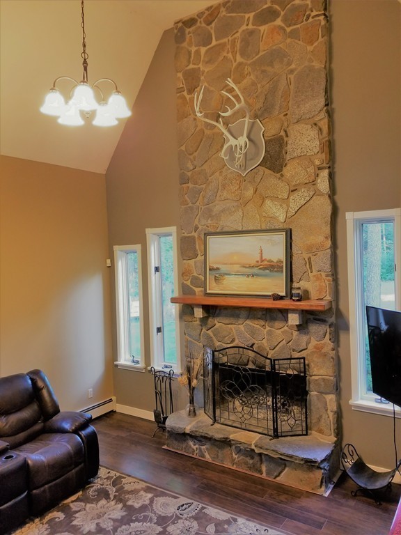 47 Laurel Lake Road Royalston, MA 01368 - Photo 8 of 10 a living room with a fireplace furniture and a fireplace