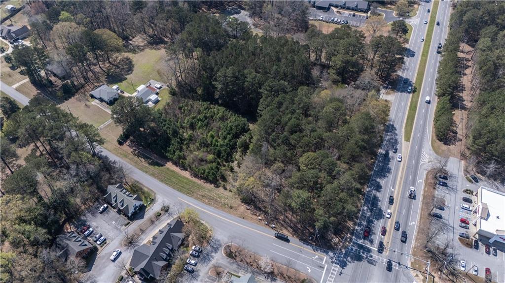 0 East Of Burch Road Fayetteville, GA 30215 - Photo 12 of 16 a view of a city with flower plants