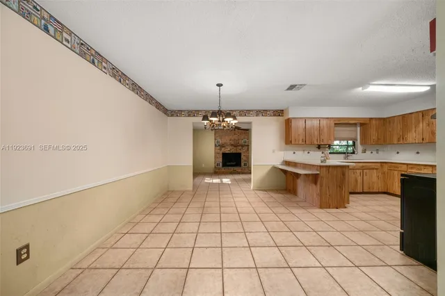 a kitchen with stainless steel appliances a sink and a refrigerator
