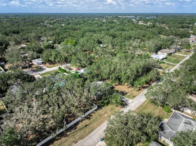 an aerial view of residential house with outdoor space