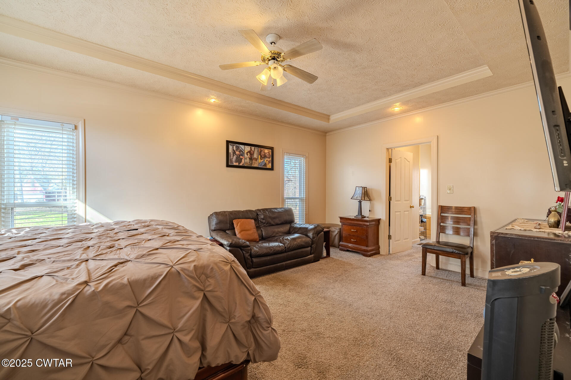43 Paddock Place Jackson, TN 38305 - Photo 14 of 38 a bedroom with furniture and a chandelier
