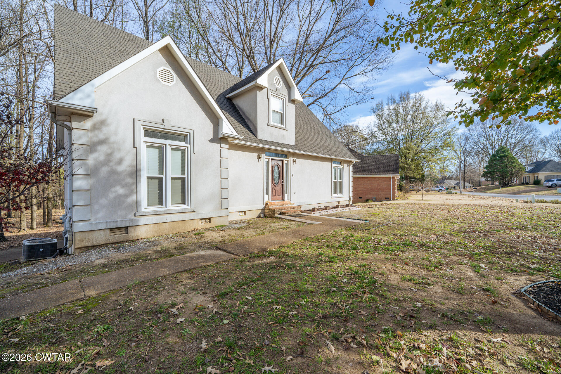 43 Paddock Place Jackson, TN 38305 - Photo 2 of 38 a front view of a house with a yard