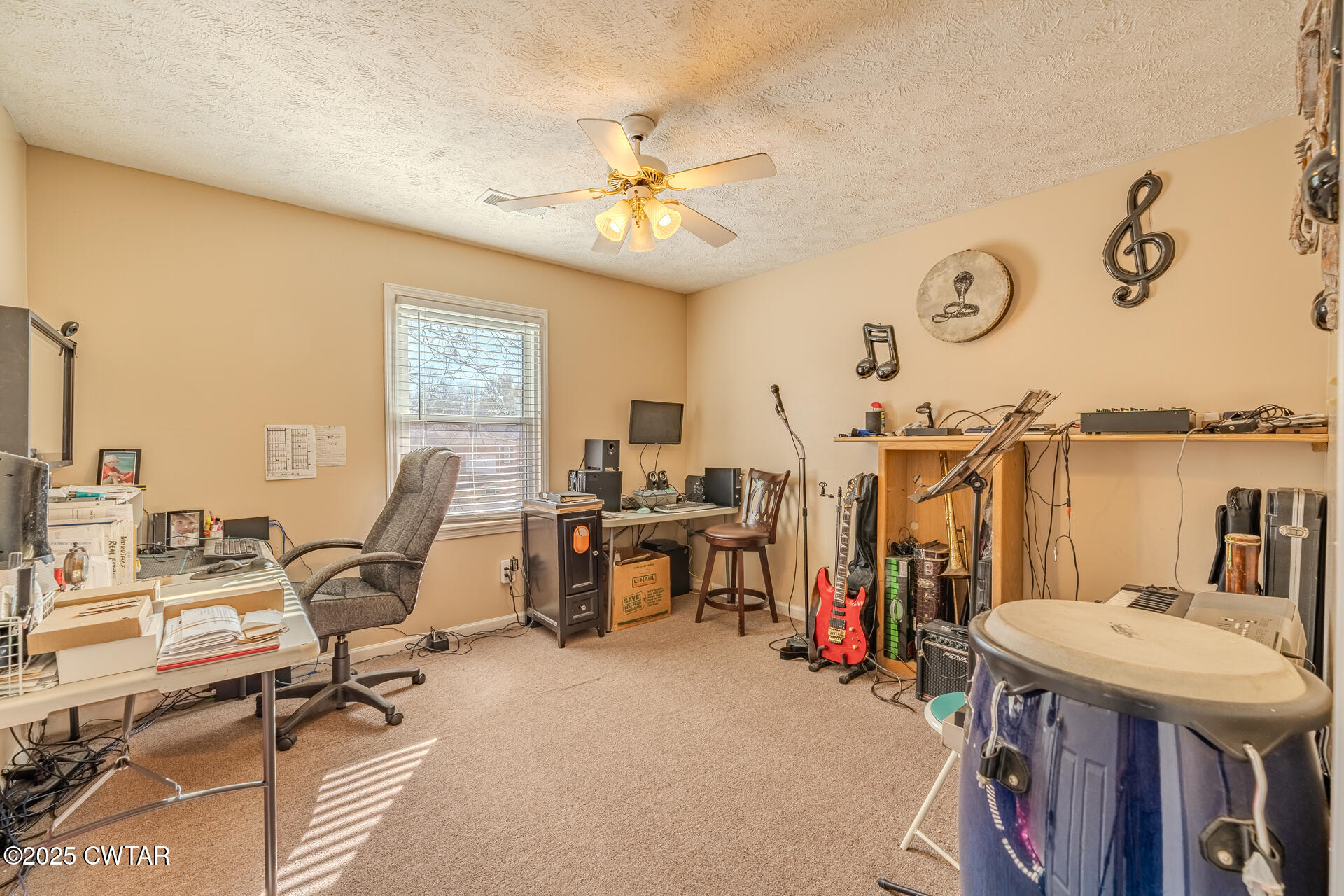 43 Paddock Place Jackson, TN 38305 - Photo 24 of 38 a view of a workspace with furniture and a ceiling fan