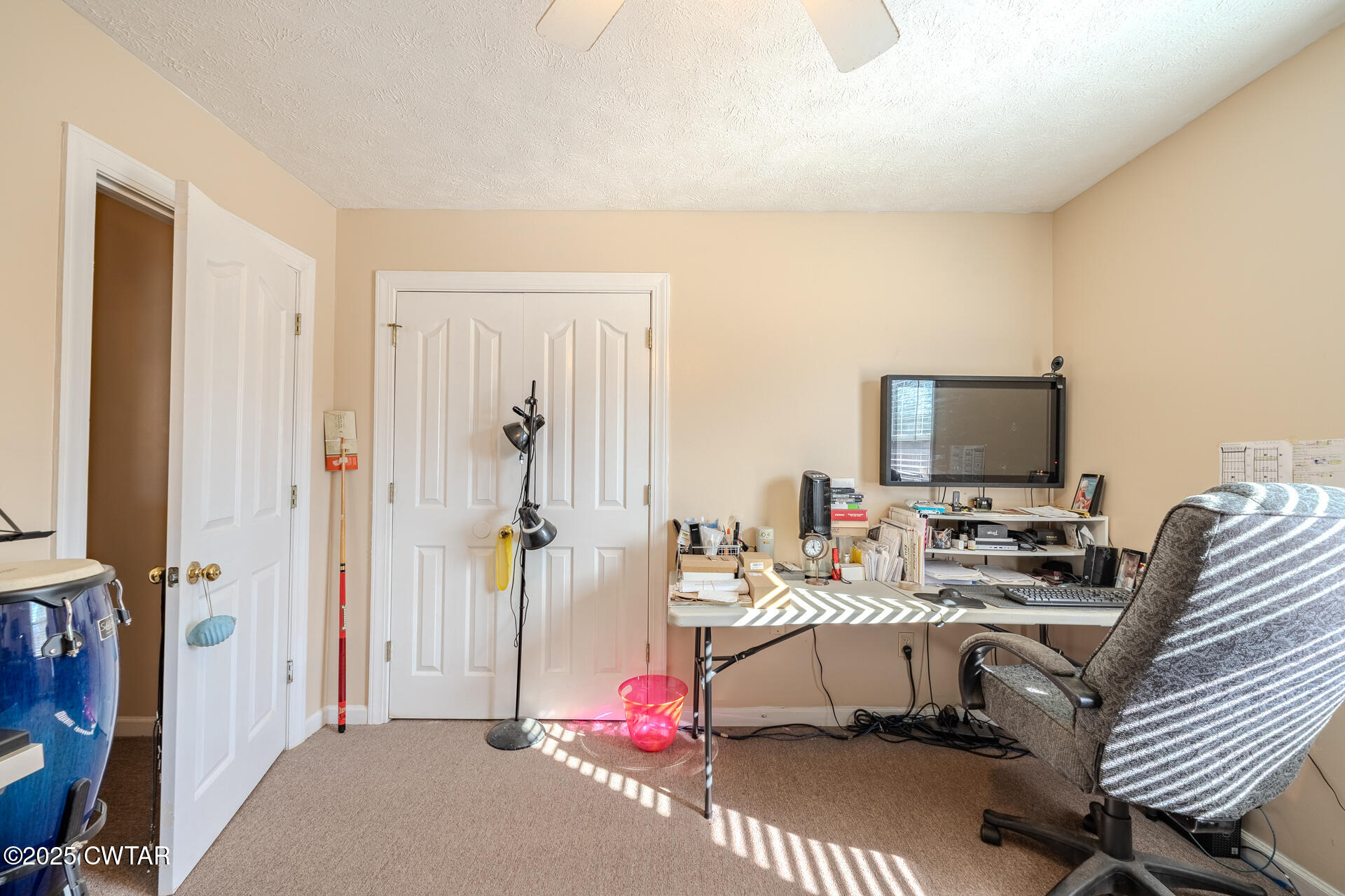 43 Paddock Place Jackson, TN 38305 - Photo 25 of 38 a bedroom with furniture and a flat screen tv