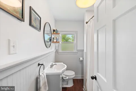 a view of a hallway with wooden shelves