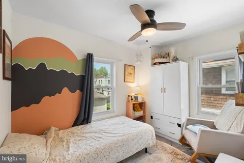 a bedroom with a bed and bathroom