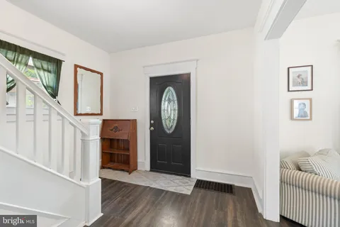 a view of entryway with wooden floor