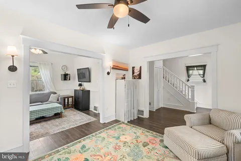 a living room with furniture and a rug