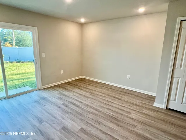 a bedroom with a bed and wall painting