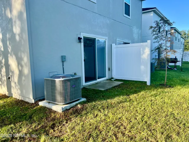 a view of a swimming pool with a yard