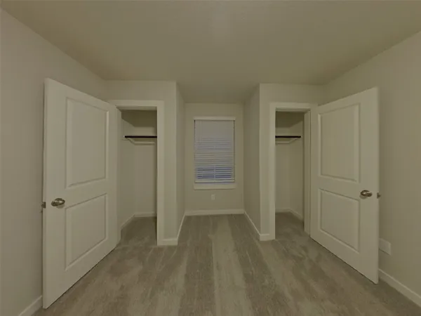 a view of a hallway with closet area