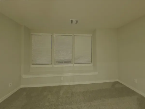 an empty room with a empty space and a window