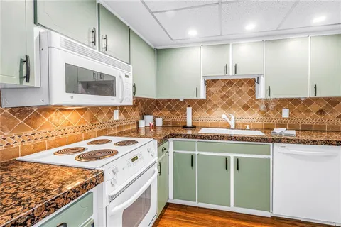 a kitchen with a stove and a sink