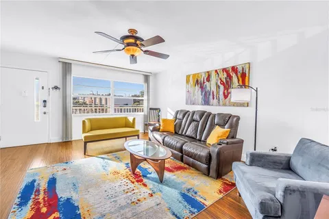 a living room with furniture and a rug