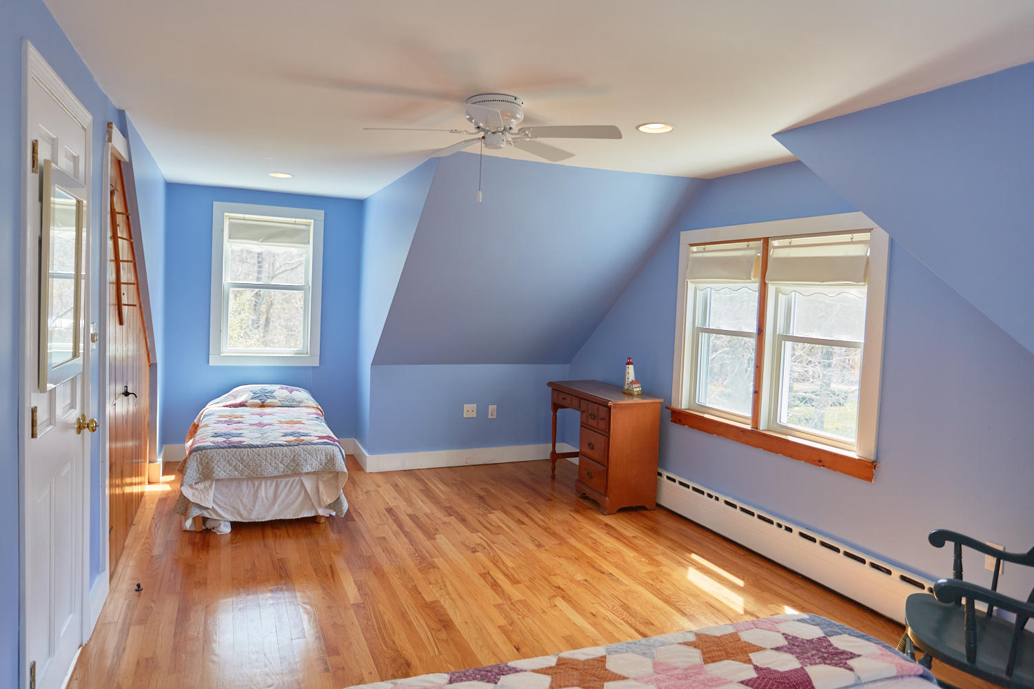 90 Pilgrim Spring Road, Unit 2667 Wellfleet, MA 02667 - Photo 20 of 25 a bedroom with a bed and wooden floor